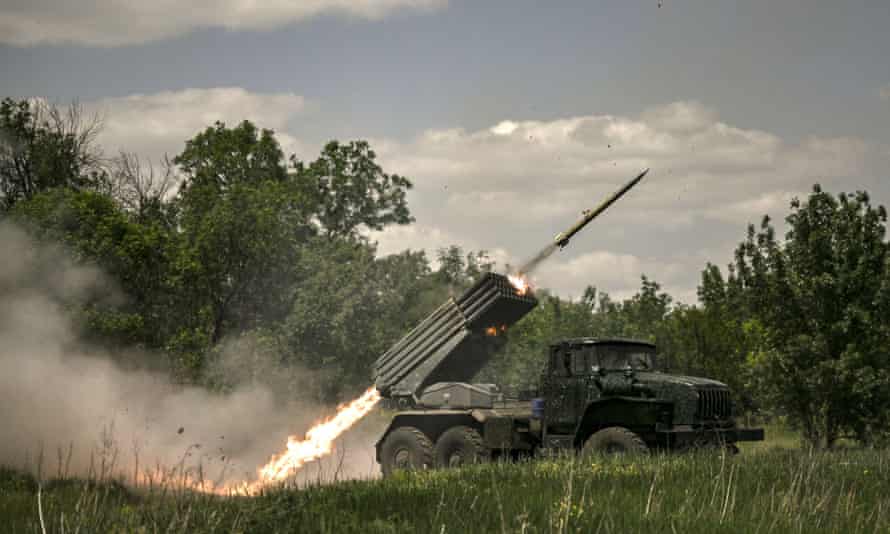 Ukrainian troops fire rockets towards Russian positions at a frontline in the Donbas region.
