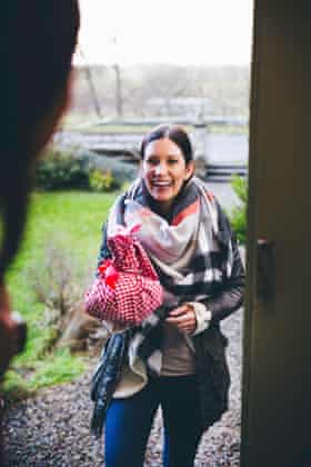 A woman arrives with a gift