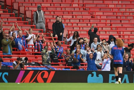 Crystal Palace fans applaud the players after their goalless draw against Arsenal at the Emirates Stadium