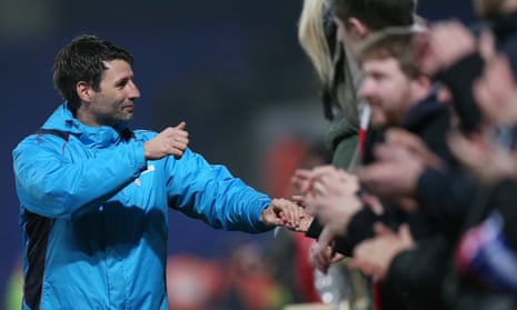 Danny Cowley, the Lincoln City manager,celebrates with supporters after their 2-2 draw at Ipswich