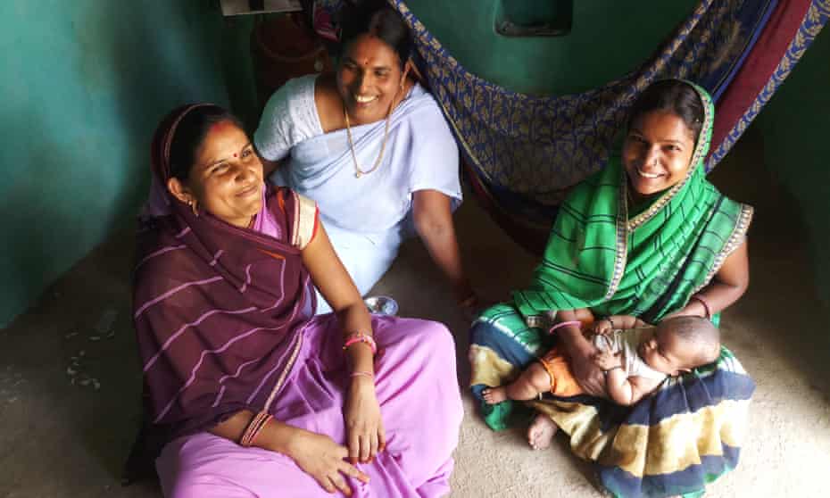Health workers Vimla Gochar and Lata Nayar visit new mother Nirmala