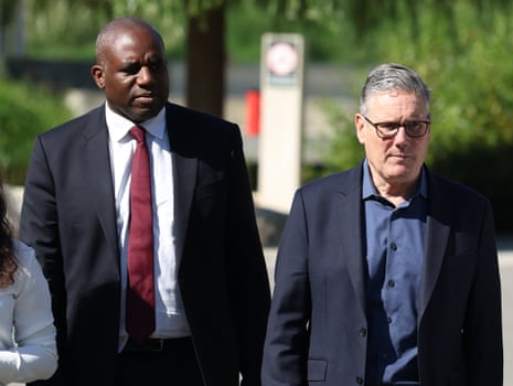 Keir Starmer and David Lammy (left) on a housing visit in Barnet this morning.