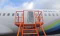 Alaska Airlines plane with a gap where the door blew out