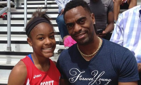 Trinity Gay poses for a photo with her father Tyson Gay in 2014. Trinity was believed to be caught in exchange of gunfire between two vehicles in a car park. 