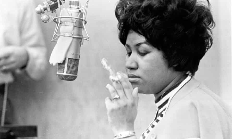 Soul singer Aretha Franklin in a recording studio smoking a cigarette