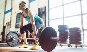 Woman Lifting Weights In A Gym Woman Lifting Weights In A Gym