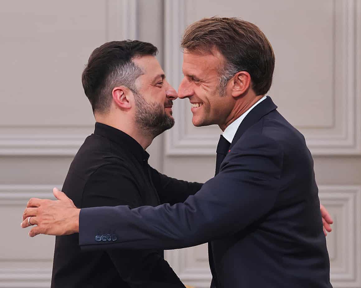 Volodymyr Zelenskyy and Emmanuel Macron greet each other