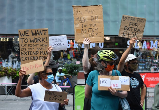Protesters rally demanding economic relief during the coronavirus pandemic, at Time Square in New York City on 5 August.