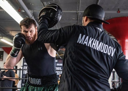Makhmudov does pad work with his trainer
