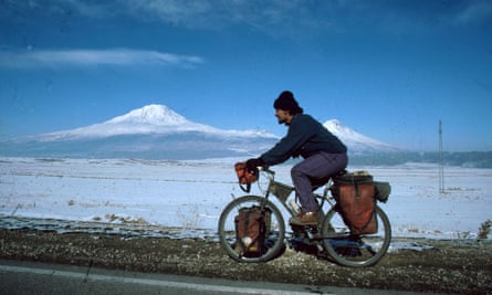 Rob Penn cycling, with Mount Ararat in Iran, near the border with Turkey, behind him