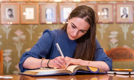 Oleksandra Matviichu signs the Nobel committee’s guest book in Norway on Friday