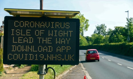 A road sign tells Isle of Wight residents to download the NHS coronavirus contact-tracing app.