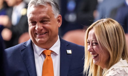 Orbán talks to the prime minister of Italy, Giorgia Meloni, at a Nato meeting in Vilnius, July 2023.