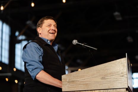 a man in front of a microphone