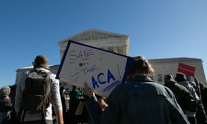 A group of protestors gathers outside of the supreme court Tuesday in Washington DC.