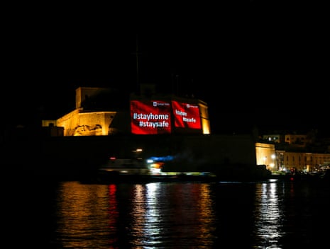 Messages warning people to stay at home during the pandemic projected on the bastions of Fort St Angelo in Valletta’s Grand Harbour
