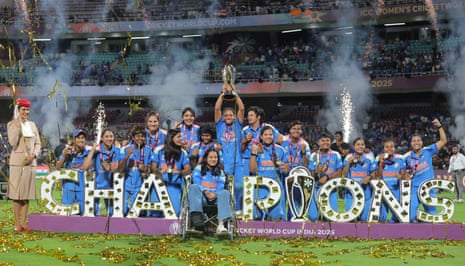 Harmanpreet Kaur of India celebrates with the ICC Women's Cricket World Cup trophy alongside team mates.