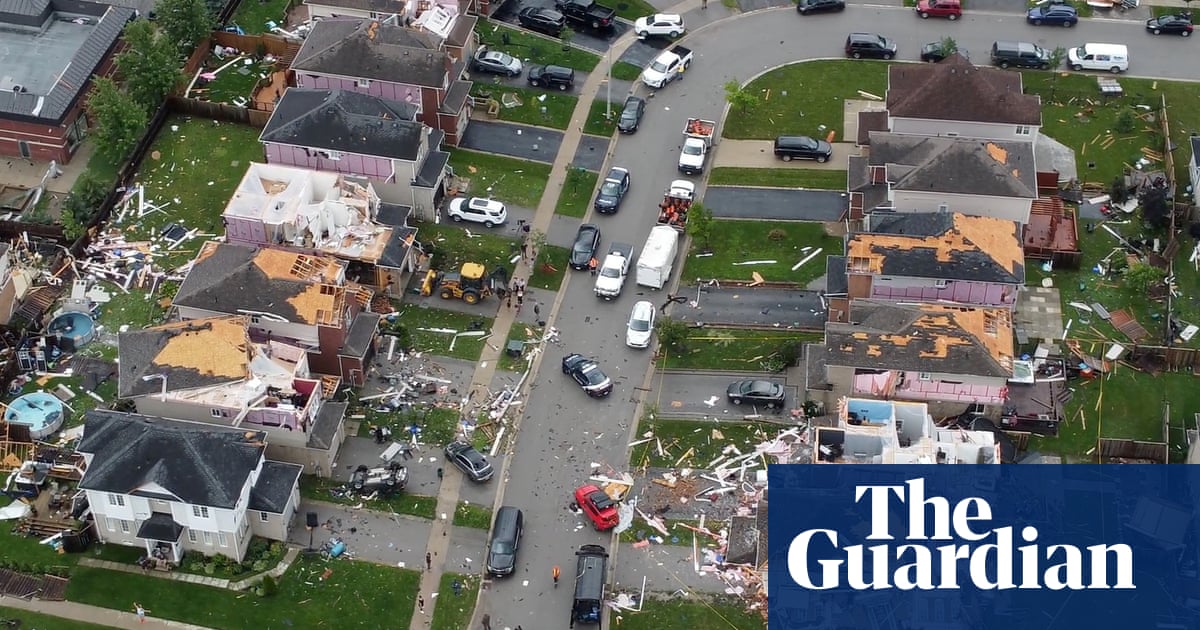 Ontario tornado: aerial views show extent of damage to building in Canadian town – video