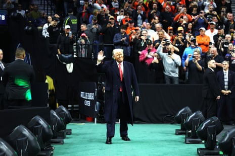 Donald Trump waves as he arrives at the NCAA Division I Men’s Wrestling Championships last month in Philadelphia.