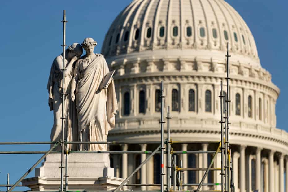 The Peace Monument surrounded by scaffolding at the west front of the US Capitol.