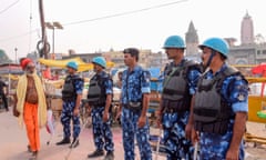 Security personnel stand guard on a street in Ayodhya