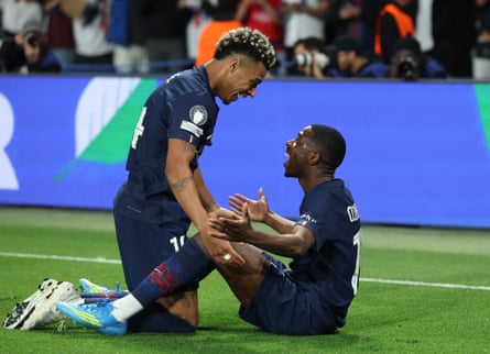 Ousmane Dembélé celebrates scoring his team’s fifth goal with Désiré Doué