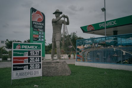 A monument to the fishermen stands in the front of a gasoline station from Pemex, the Mexican state-owned petroleum company, in Tuxpan, Veracruz. Due to a decline of fish in the last years, many locals have migrated to work in maquilas in the Northern states.