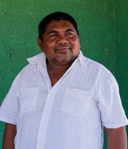 A heavy-set middle-aged man in a white shirt