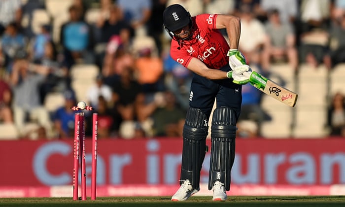 England captain Jos Buttler is bowled by Bhuvneshwar Kumar of India.