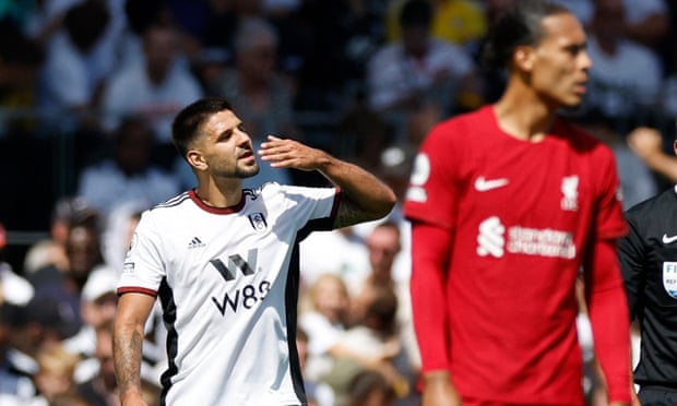 Aleksandar Mitrovic salutes the Fulham fans after scoring his second goal of the afternoon against Liverpool.