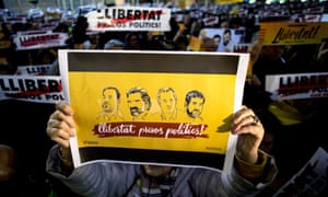A supporter shows a banner during the demonstration to support Catalonian political leaders Oriol Junqueras, Joaquim Forn, and ANC president Jordi Sànchez and Omnium president Jordi Cuixart, who remain in prison.