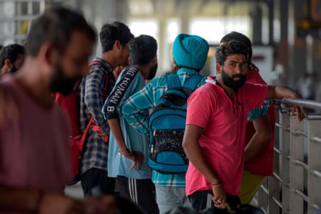 Indian nationals arrive at the New Delhi airport in October after being deported from Mexico as they tried to enter the US. 