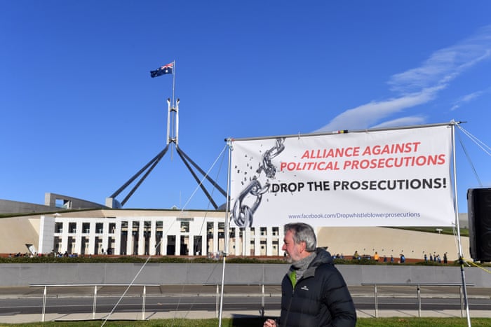 A protester at a rally in support of Witness K and Bernard Collaery, in front of Parliament House in Canberra last year.