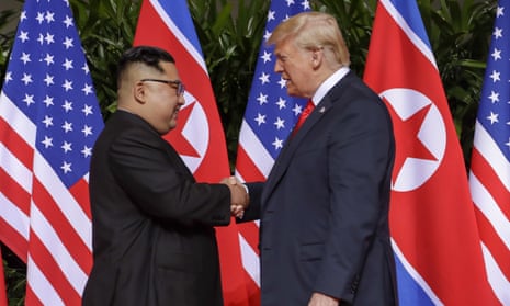 President Donald Trump, right, shakes hands with North Korean leader Kim Jong Un at the Capella resort on Sentosa Island in Singapore.