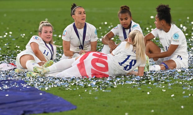 Chloe Kelly has a lie down in front of (from left to right) Lauren Hemp, Lucy Bronze, Nikita Parris and Demi Stokes as they take in their triumph.