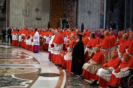 Cardinals stand, on the day of the translation of Pope Francis' body, in St. Peter's Basilica at the Vatican.
