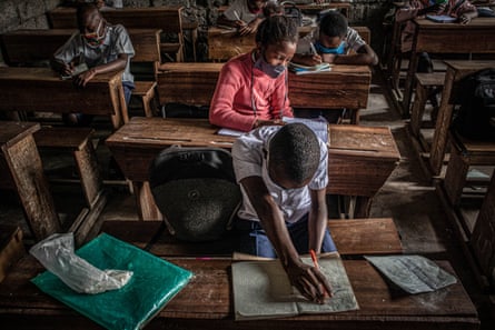 Students attend class as schools reopened in the eastern city of Goma in August