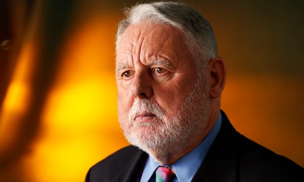 Terry Waite looking stern in a suit.