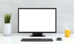 Large PC monitor in front of a concrete wall<br>White brick wall, with PC working setup in front of it, white