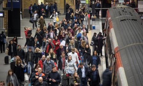 Passengers at London’s King’s Cross station.