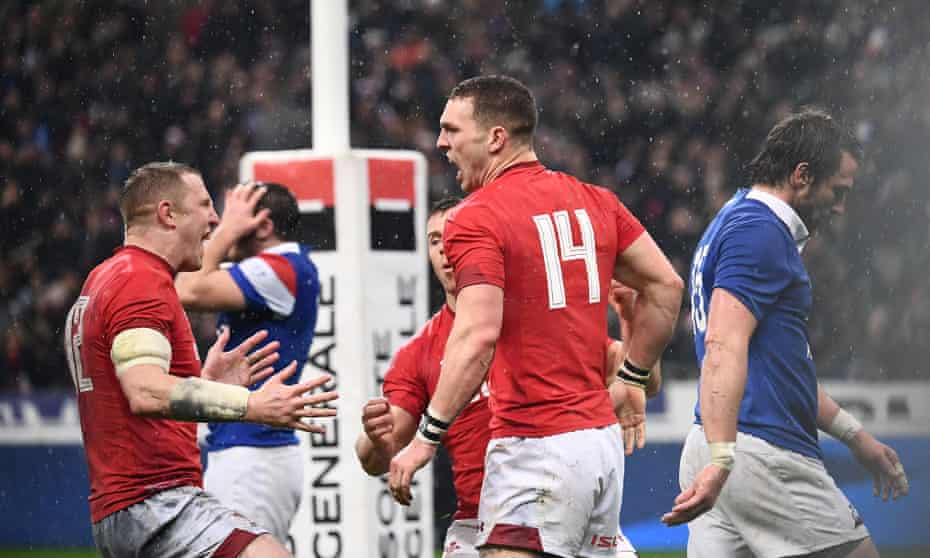 George North celebrates with his Wales teammates after scoring his second and decisive try to complete a remarkable turnaround against France.