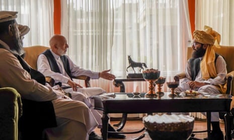 A Taliban photograph shows Hamid Karzai, centre left, talking to Anas Haqqani, right, leader of the Haqqani Network of the Taliban.
