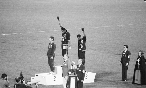 Tommie Smith and John Carlos raise their fists in protest of racial injustice in the United States at the 1968 Olympic Games