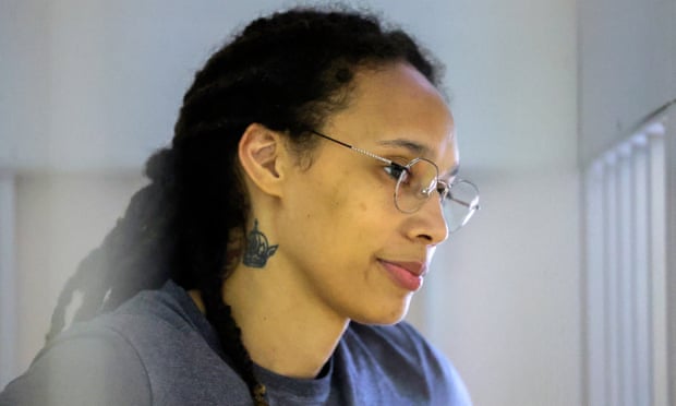 US basketball player Brittney Griner sits inside a defendant's cage in a court outside Moscow, Russia on Thursday.