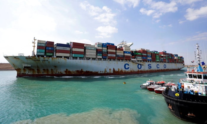A shipping container of the China Ocean Shipping Company moving through the Suez Canal in Suez, Egypt.