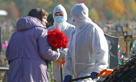 The funeral for a person who died of coronavirus at the Novo-Yuzhnoye cemetery, in Omsk, Russia
