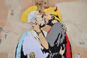 A collage shows Pope Francis kissing US President Donald Trump on May 11, 2017 near Castel Sant’Angelo in central Rome
