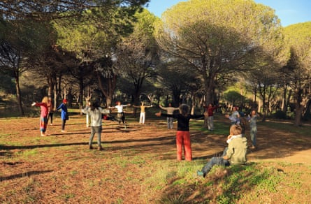 Walkers gather in a woodland clearing.