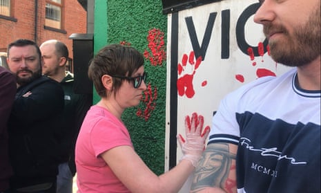 Friends of the journalist Lyra McKee deface the walls of Saoradh’s offices in Derry with red paint