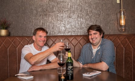 Portrait of Tony and Tom clinking wine glasses